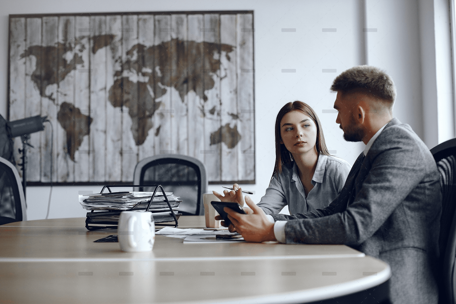 man-uses-tablet-business-partners-business-meeting-people-are-sitting-table.jpg